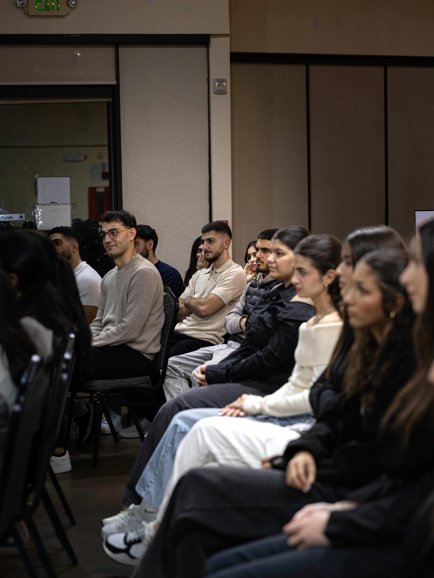 Engaged audience at a NAYI event.